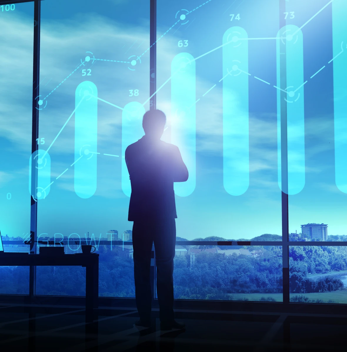Man standing before futuristic financial display