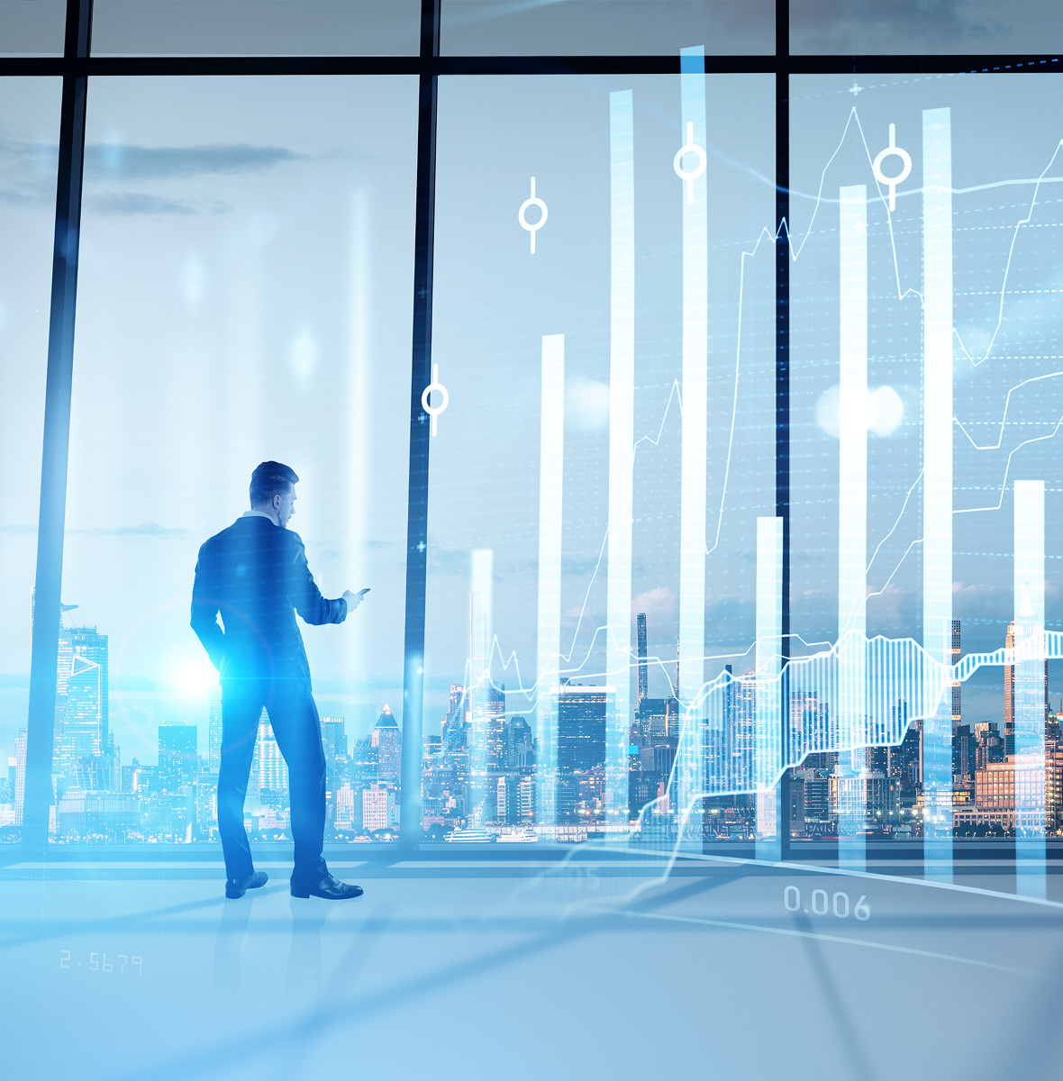 Executive reviewing data on large window display