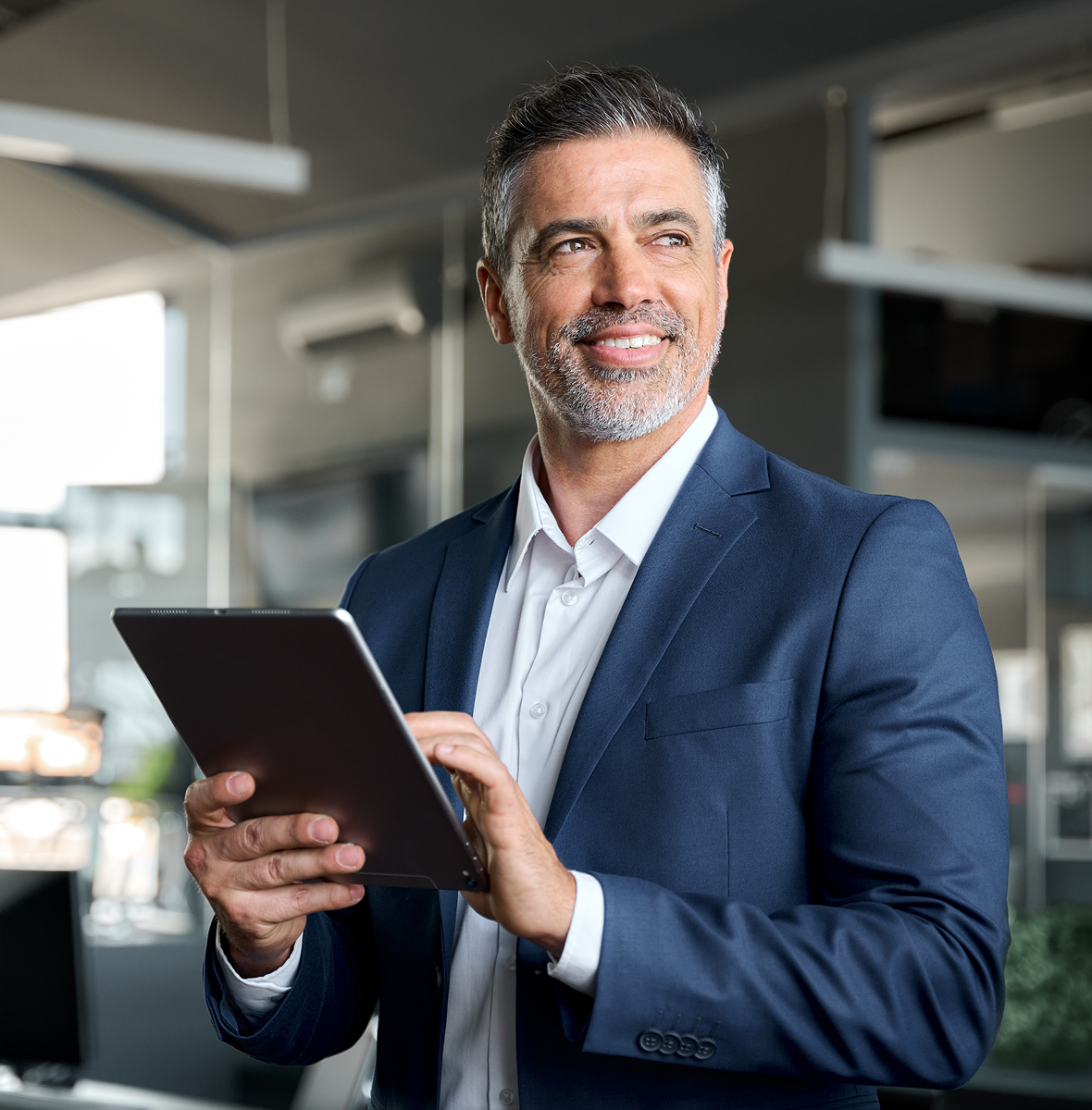 Man in suit using digital tablet
